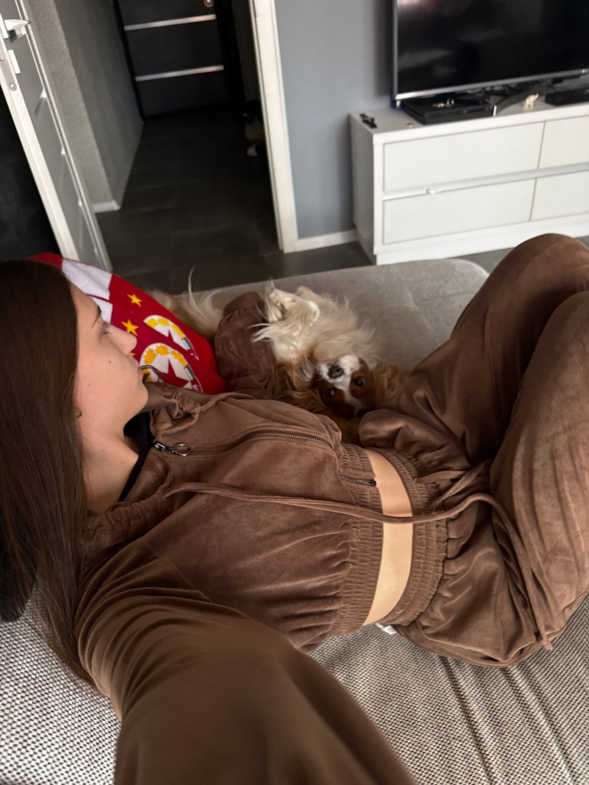 Woman documents cozy morning with dog in Sofia apartment