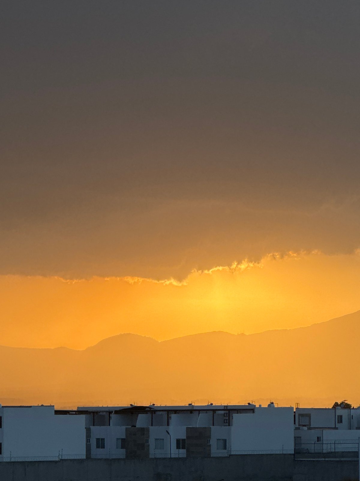 Sunset captured over San Francisco Ocotlán urban landscape