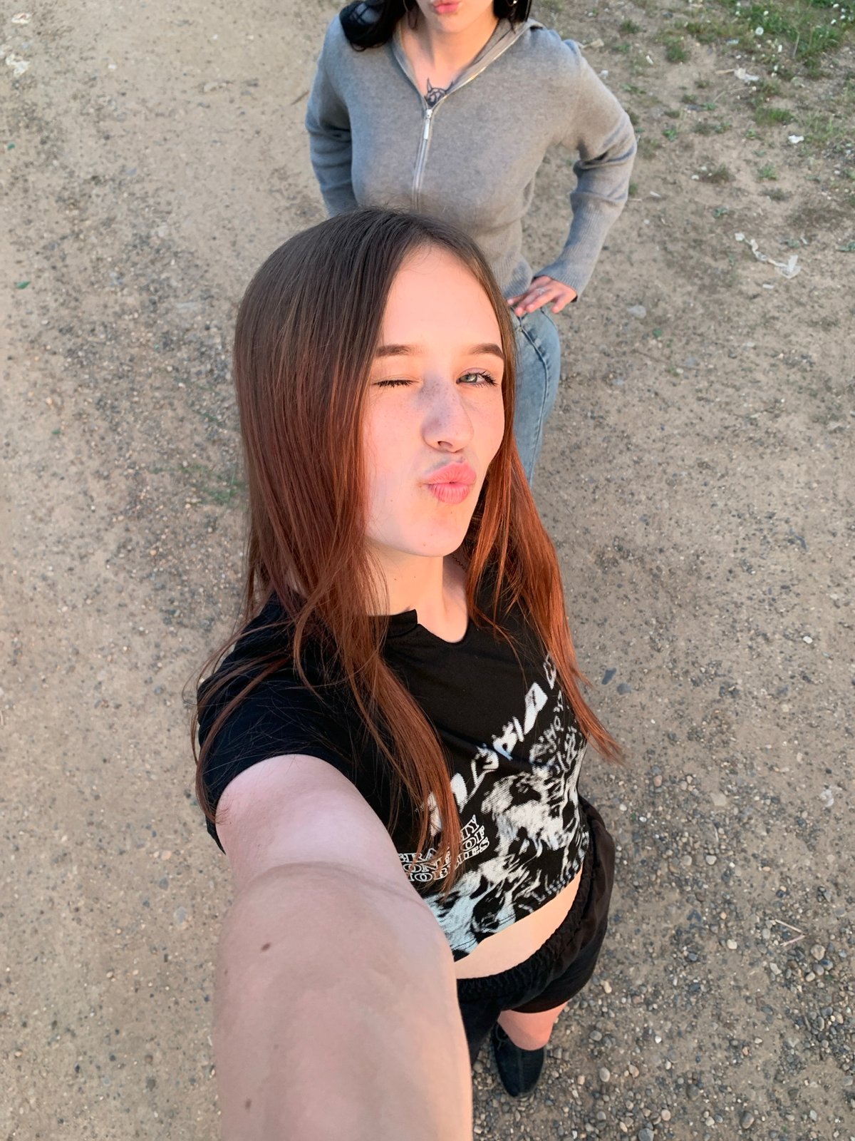 Young women take sunset selfies in Фоки, Russia