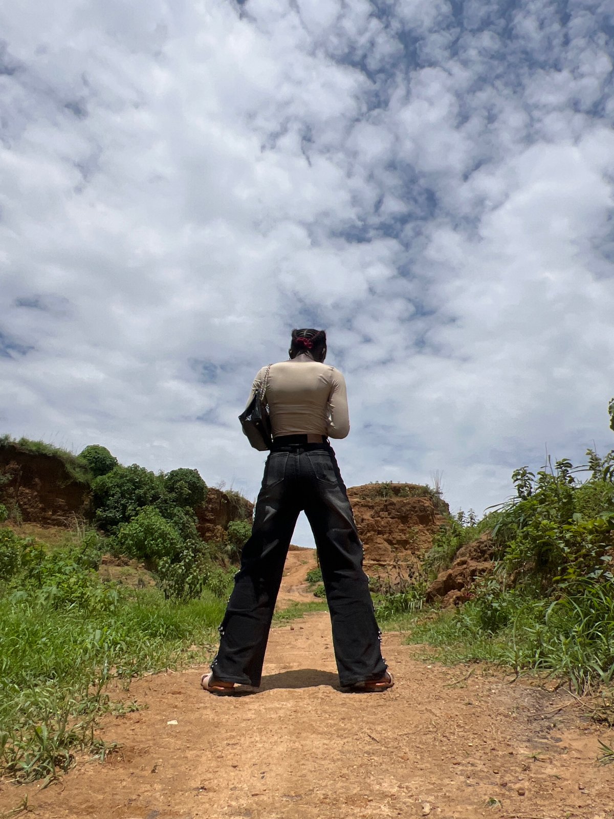 Rural Jos: eroded hillsides, stream crossings, and local life