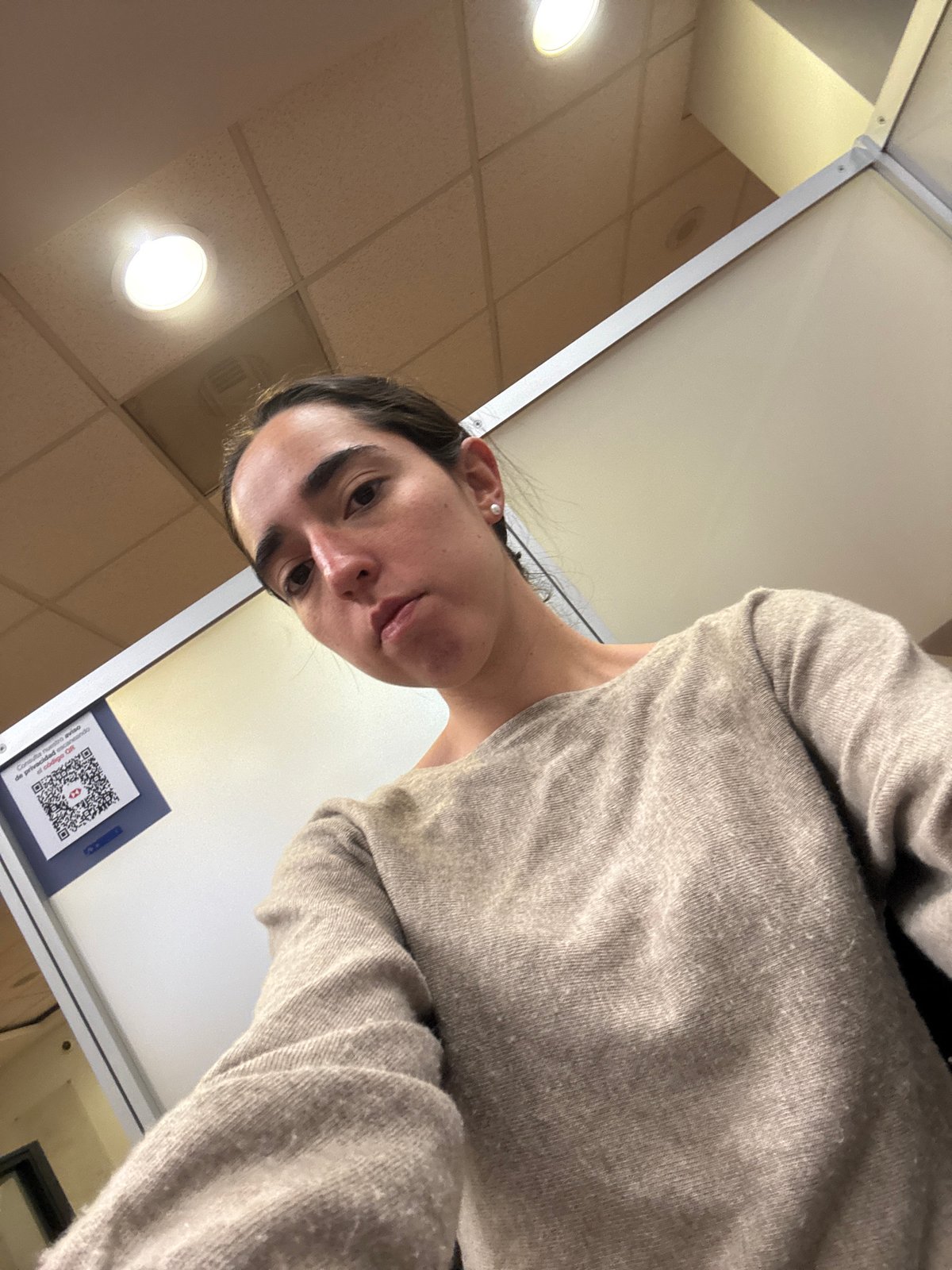 Woman takes selfie in Mexico City office setting