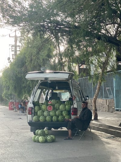 Watermelon vendor operates from roadside van in Kandahar