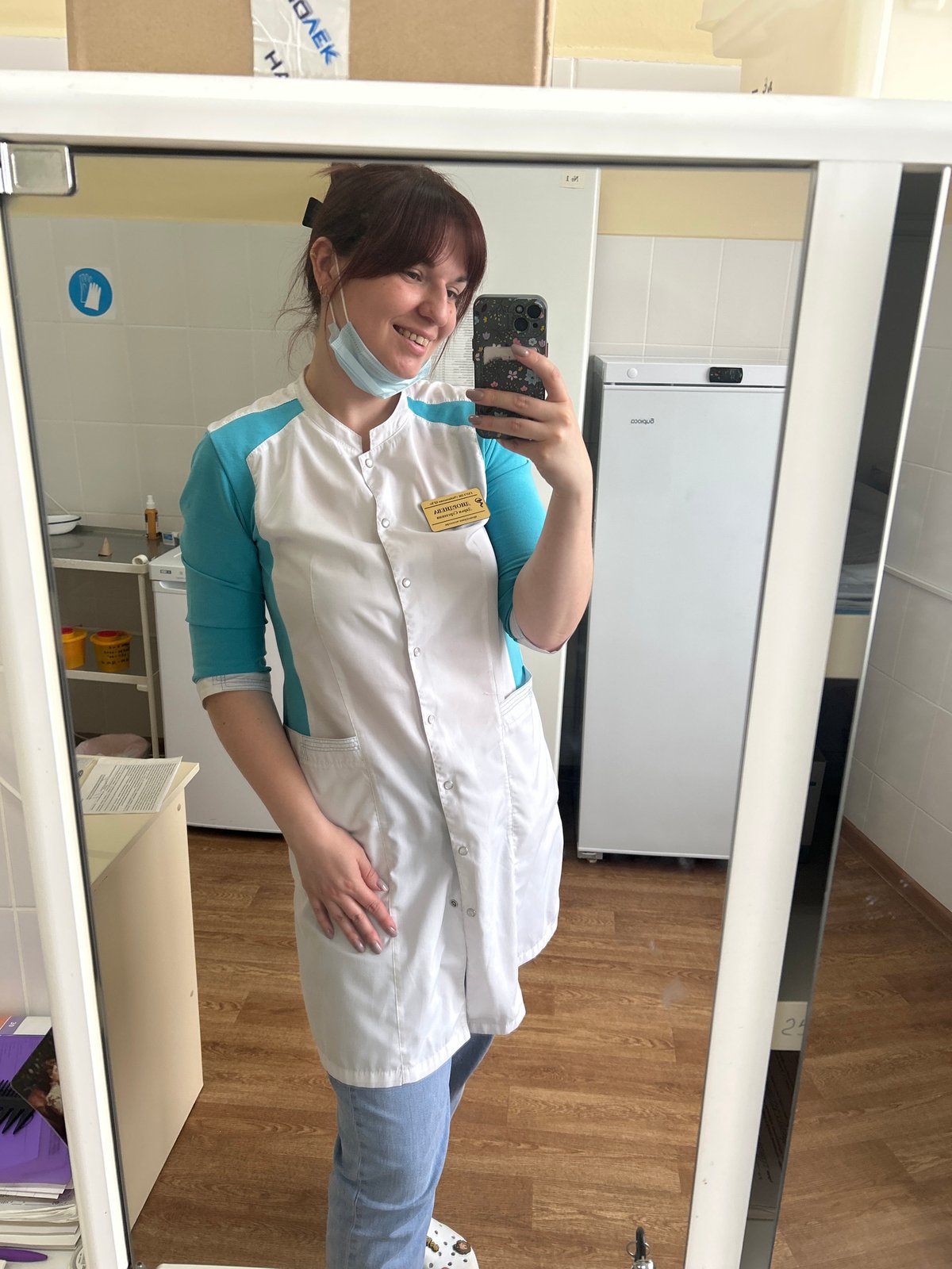 Medical worker takes playful selfies with chocolate during shift