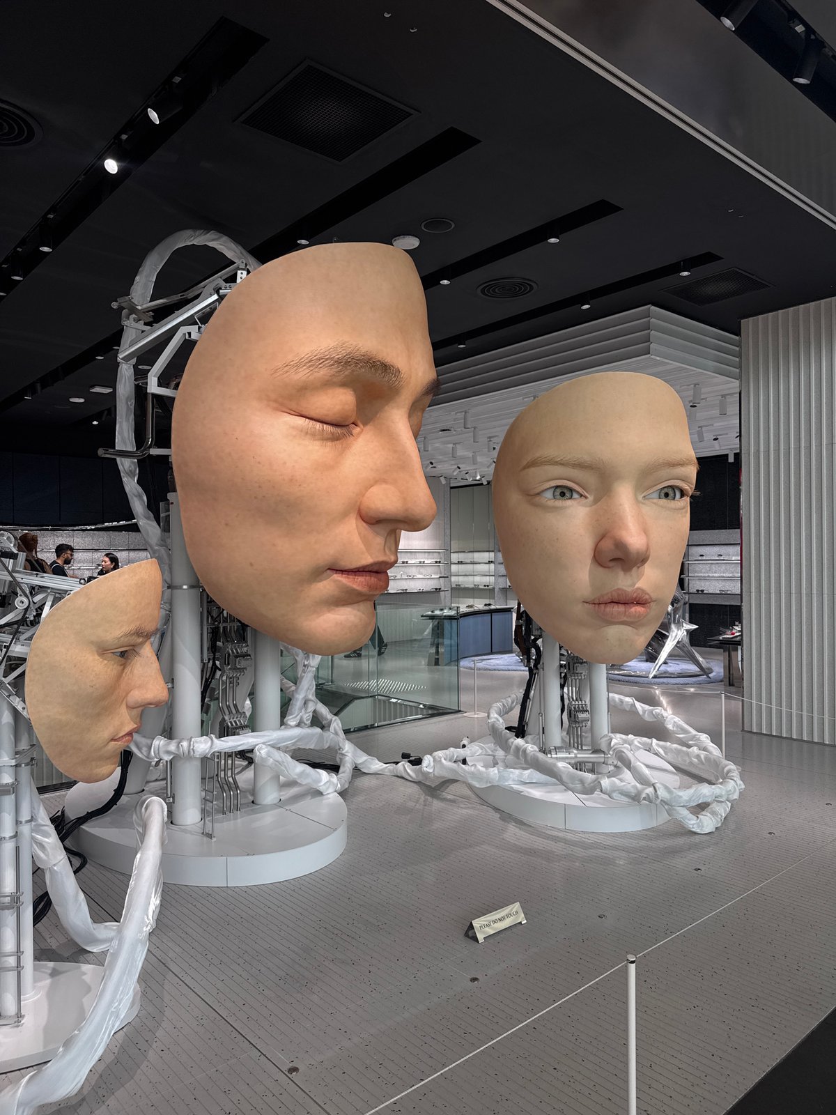 Hyperrealistic head sculptures draw attention inside Marina Bay Sands