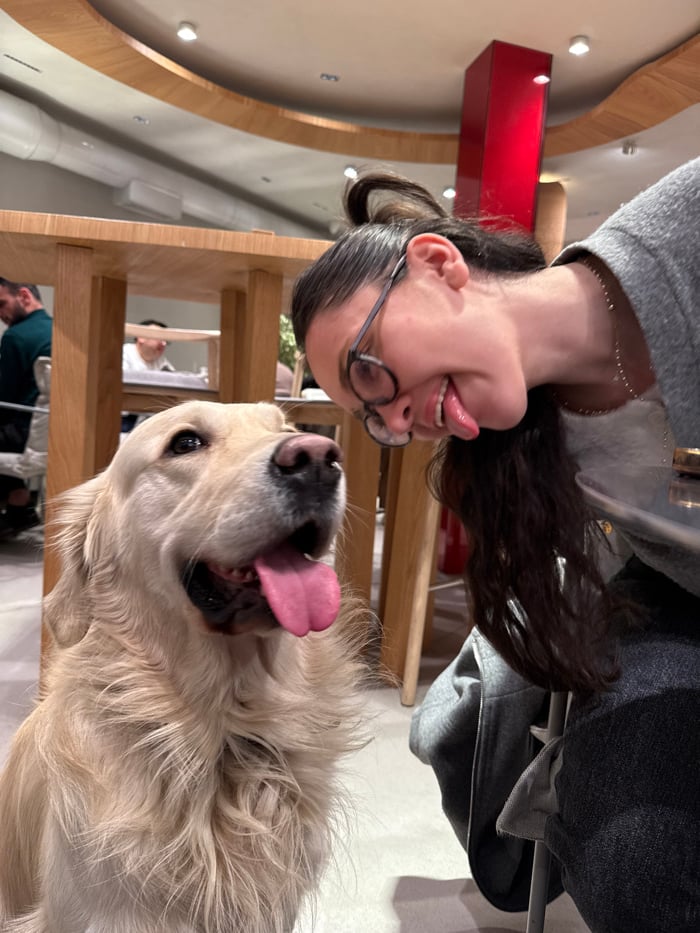 Woman spends evening browsing records, vaping at café with dog