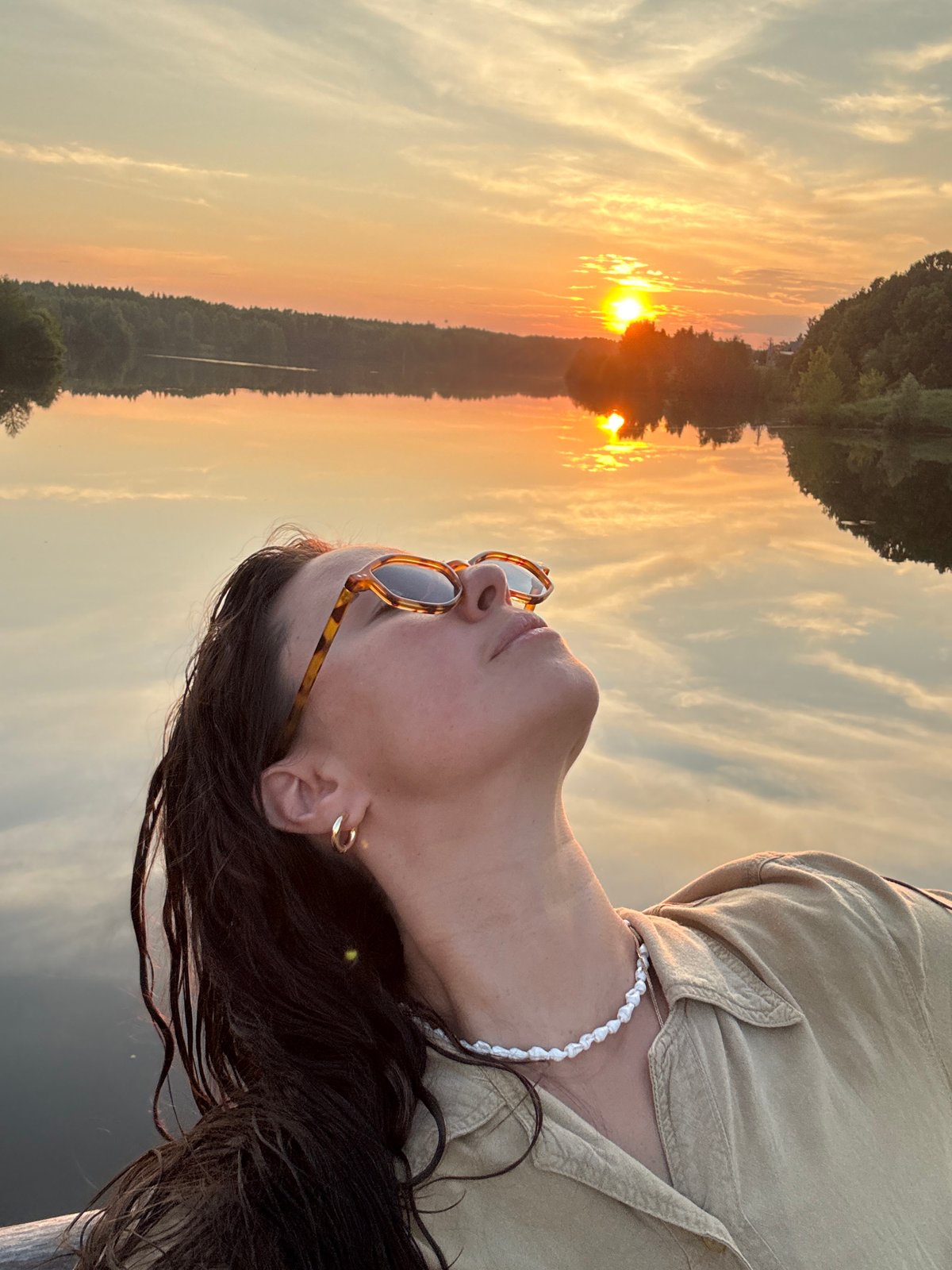 Golden hour lake swim in Kamysh with husky companion