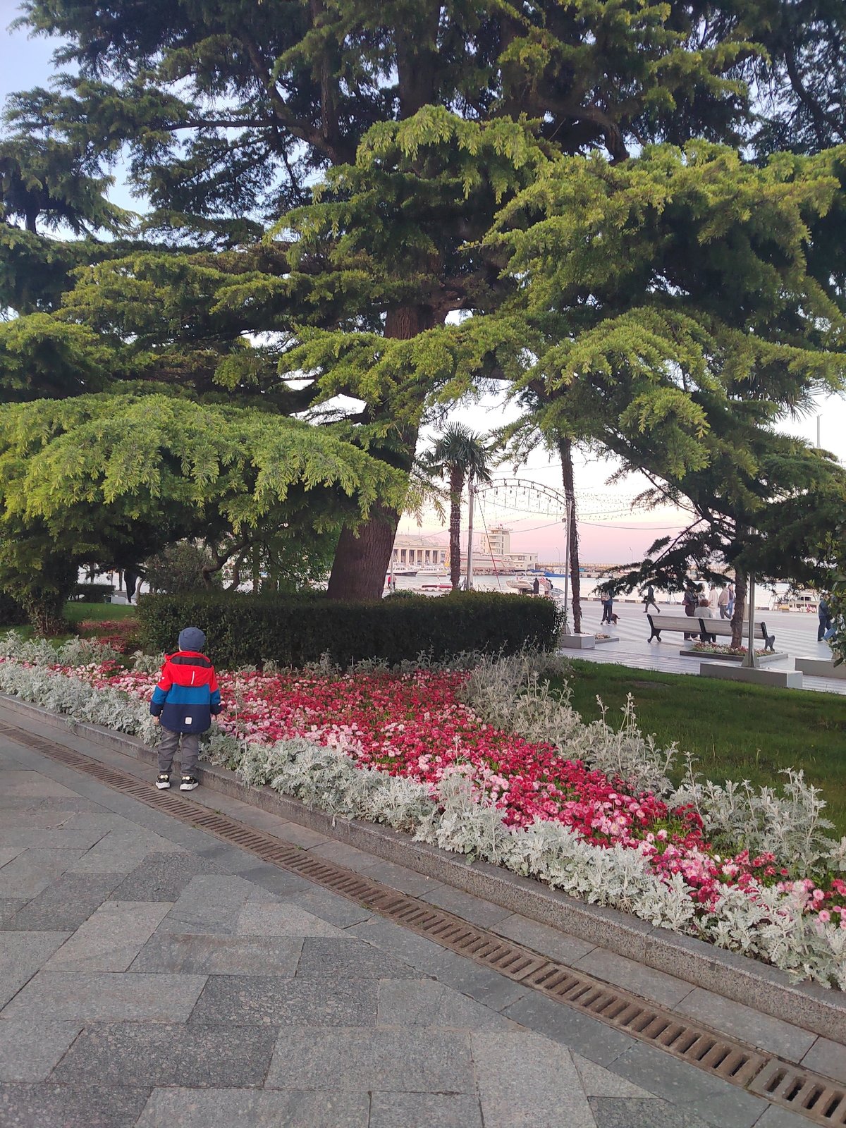 Urban waterfront promenade documented during afternoon hours May 18