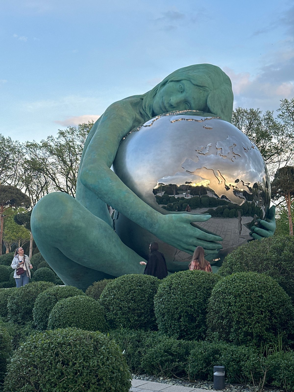Tourist takes selfie at globe sculpture in Krasnodar park