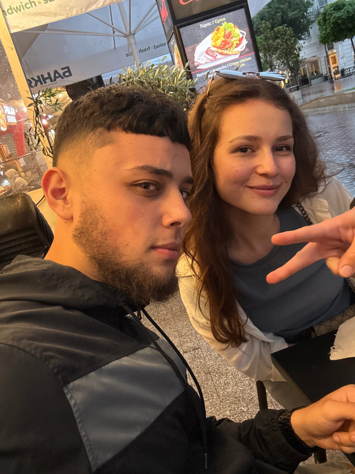 Young adults share evening street food meal in Varna