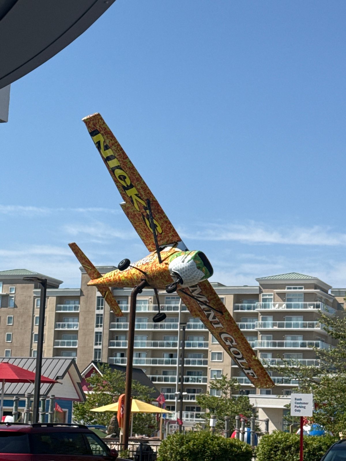 Ocean City mini golf displays American flags, decorative airplane signage