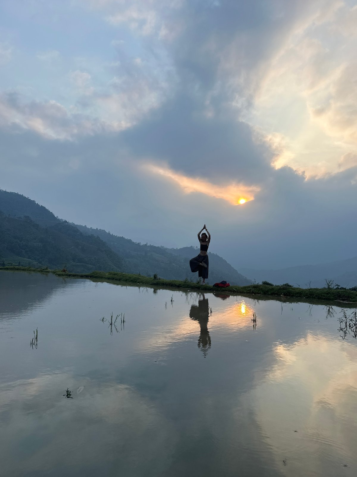 Tourists photograph sunset moments at Vietnam rice terraces