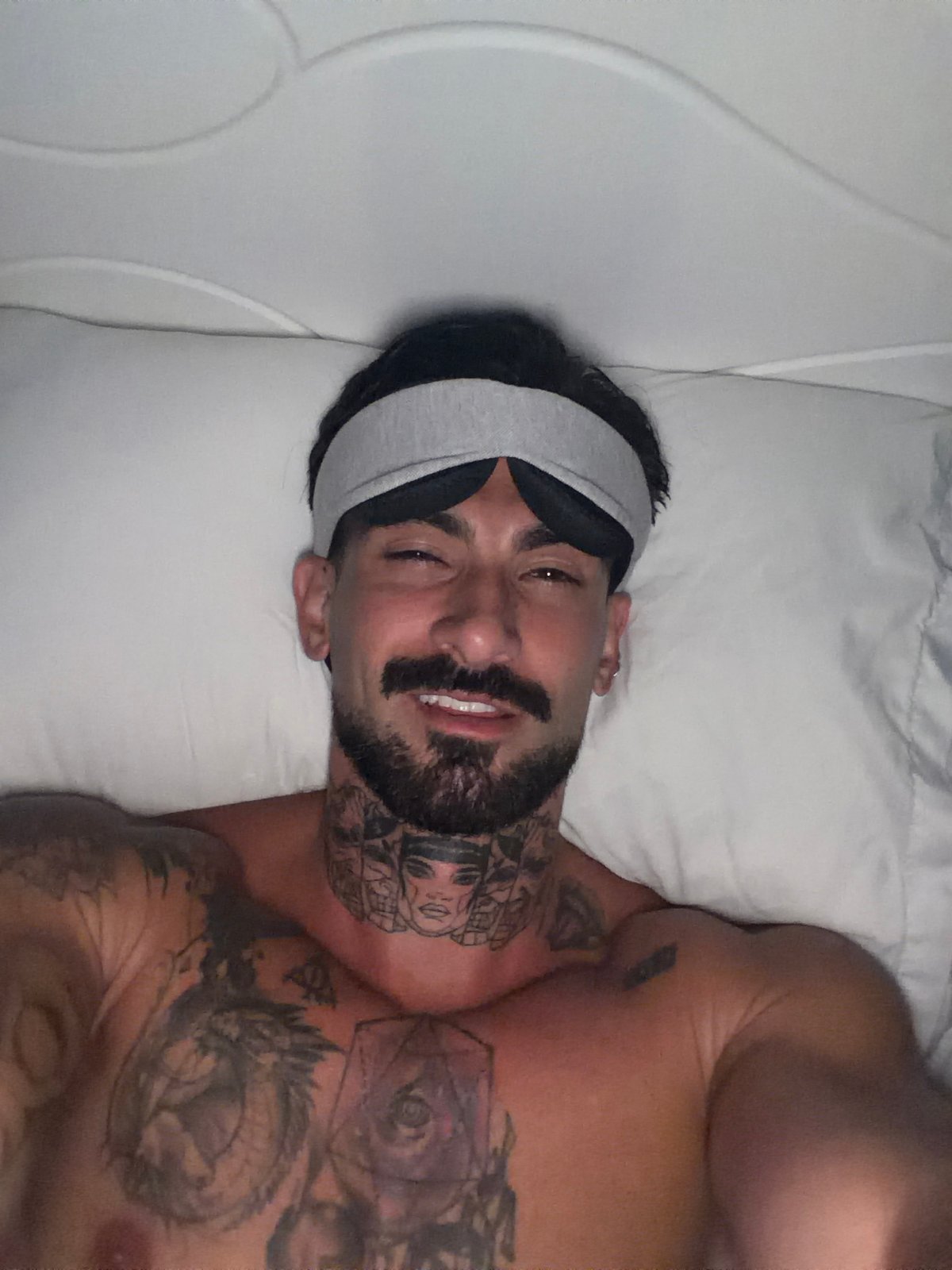Man rests with sleep mask in Chalong bedroom