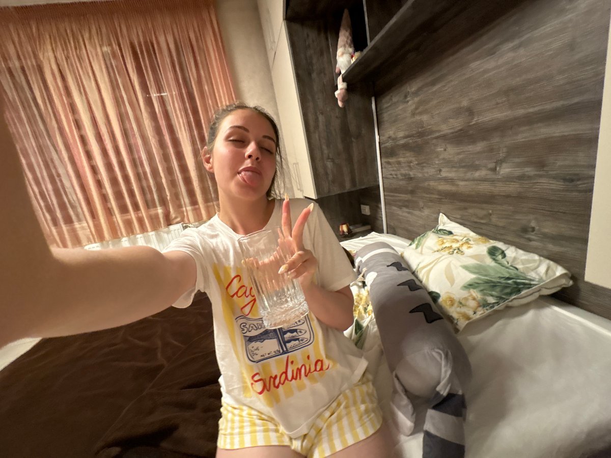 Woman photographed relaxing in bedroom in Bulgarovo, Bulgaria