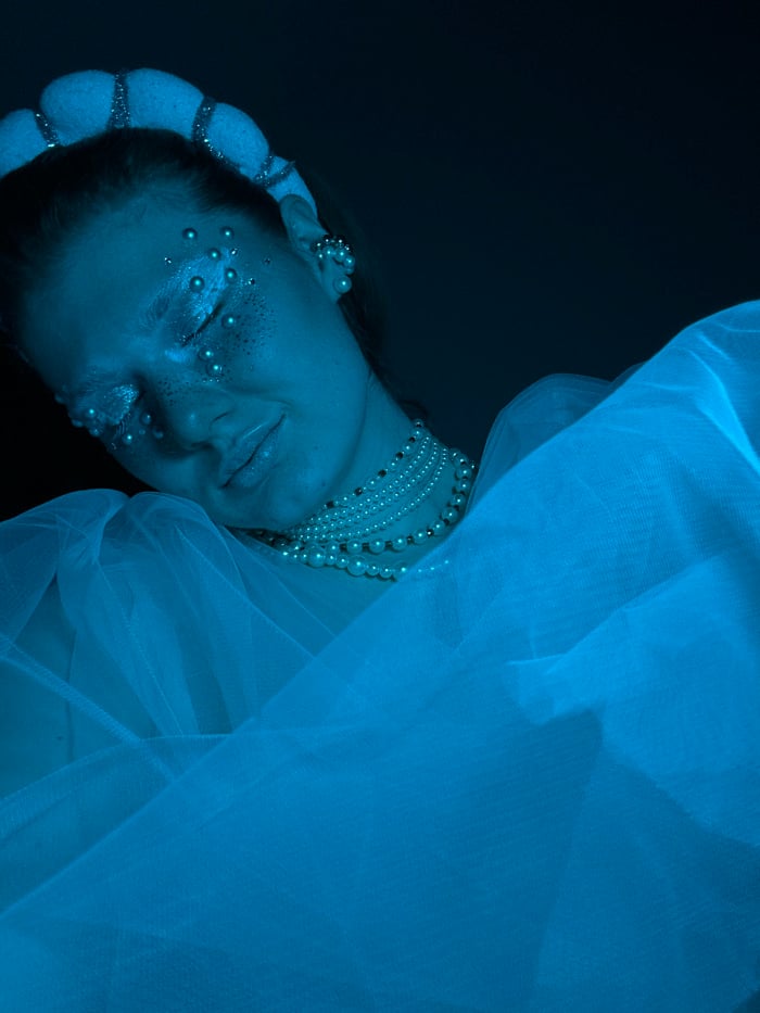 Woman in theatrical makeup photographed multiple times in Kazan