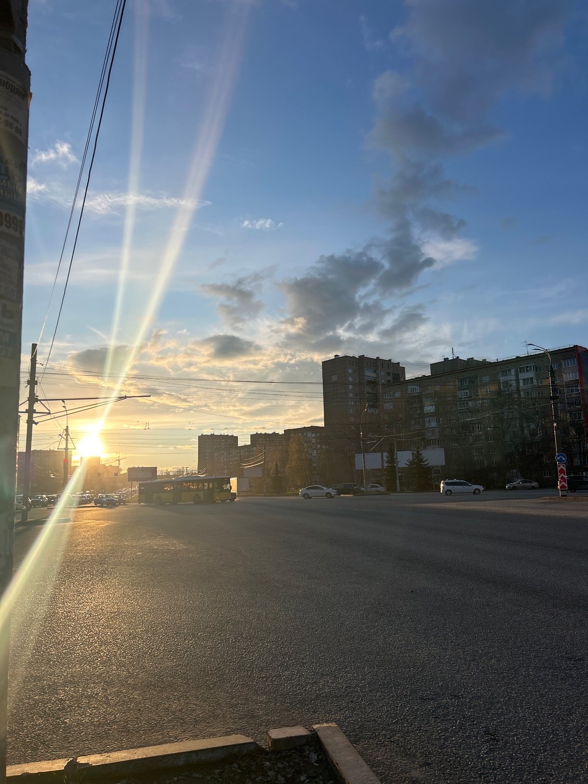 Golden hour sunset illuminates Izhevsk street scene