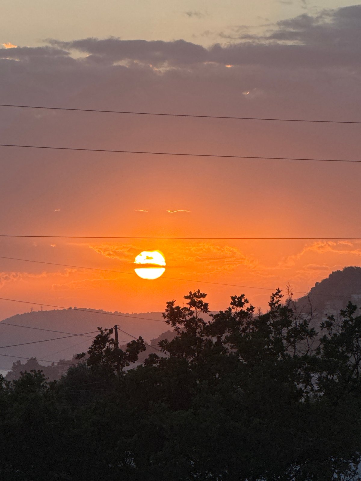 Witness captures sunset and cityscape views in Sustaš, Montenegro