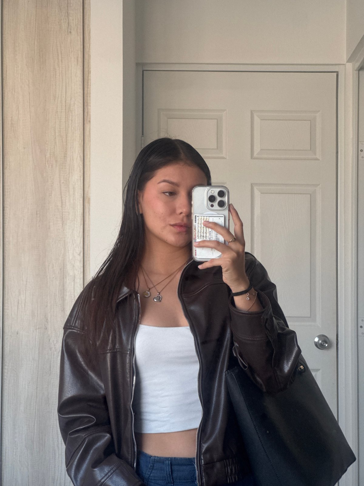 Young woman takes mirror selfies in Ocotlán, Mexico
