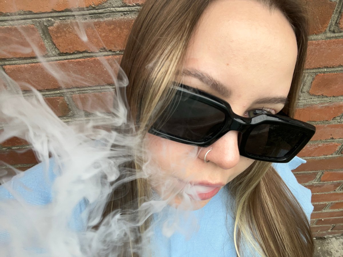Afternoon moments captured in Russian village: woman vaping, pets, gardens