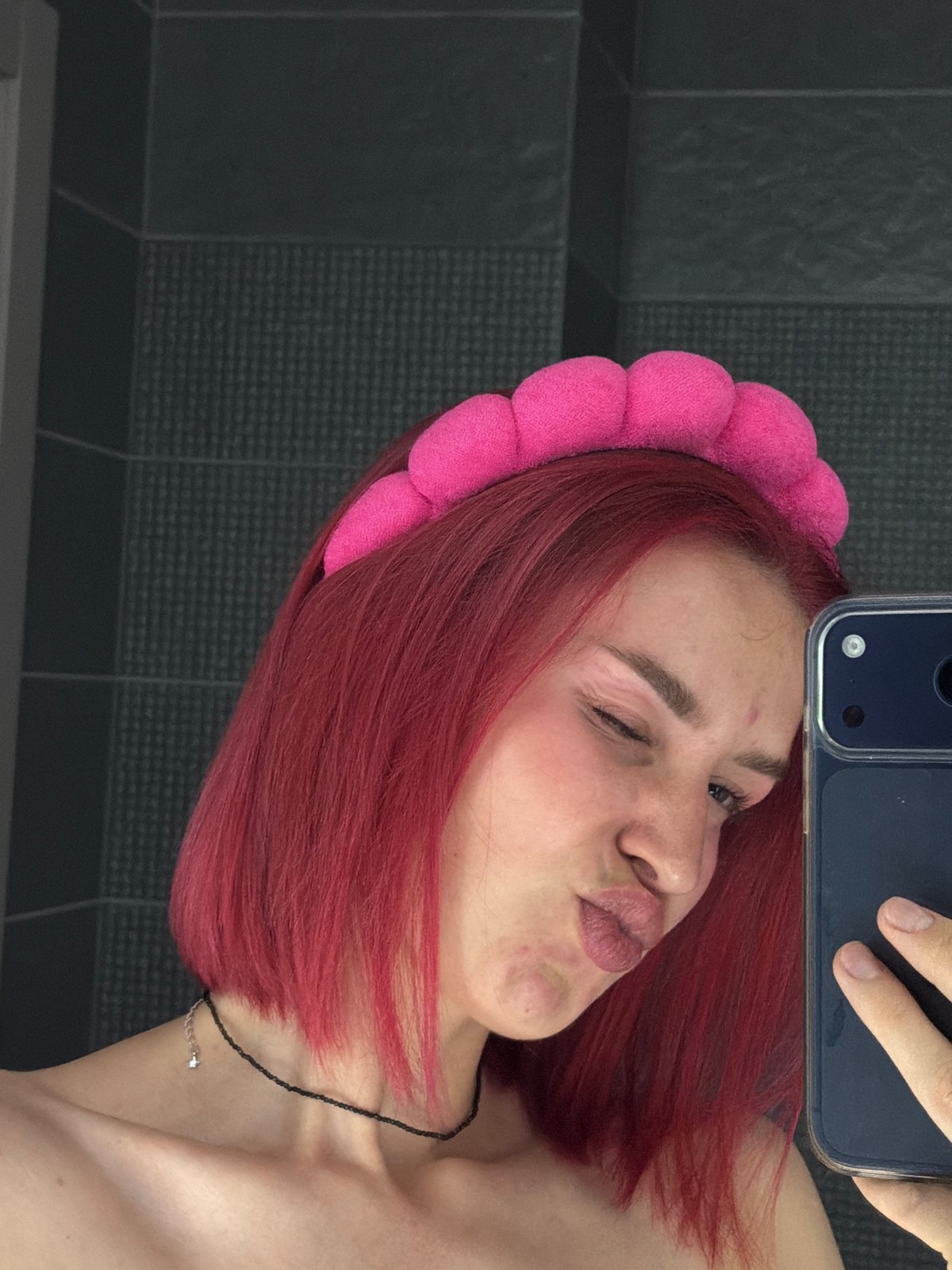 Pink-haired person photographed multiple times in Chaikovsky, Russia