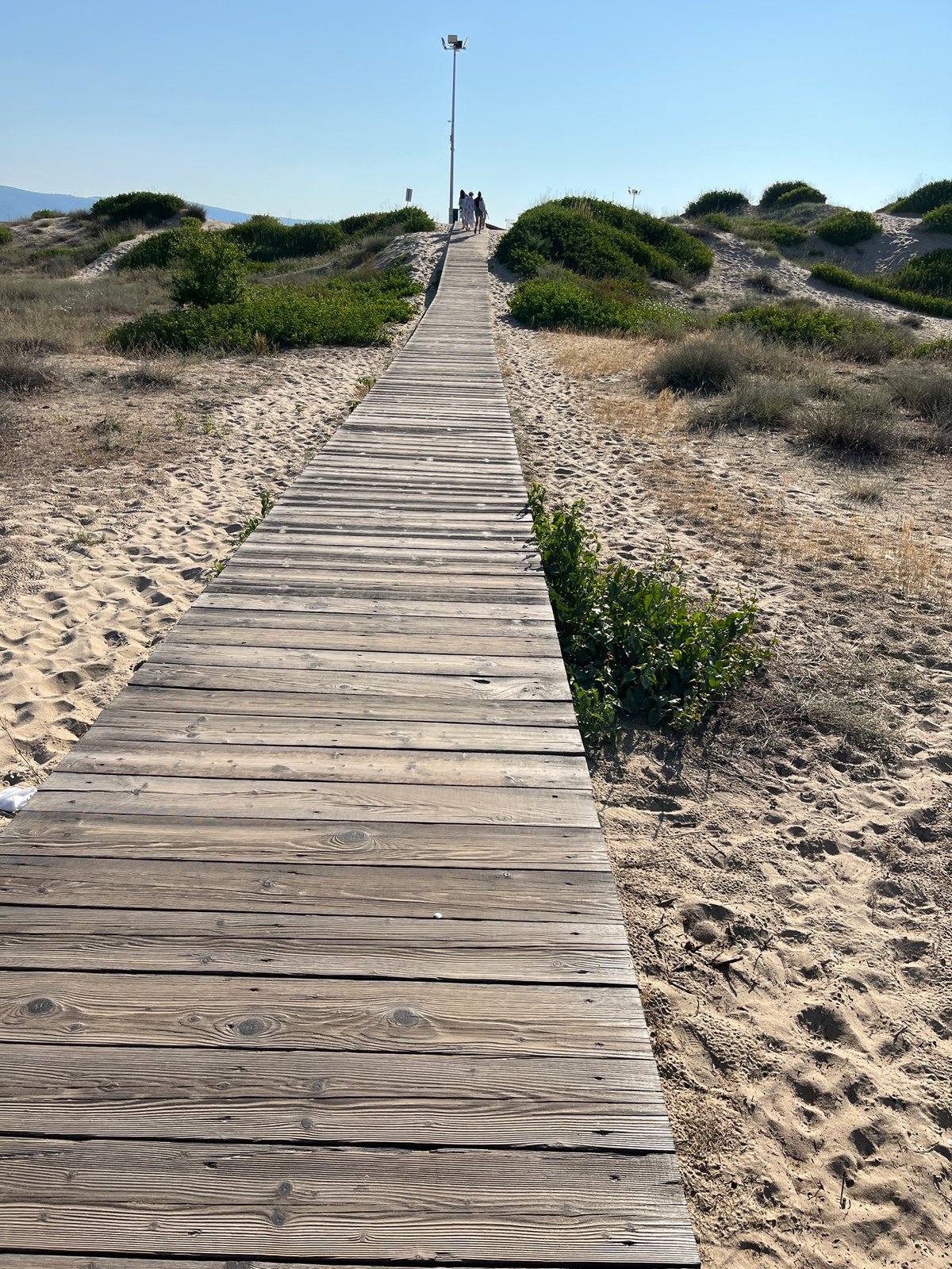 Sandy beach and boardwalk scene along the Nesebar coastline