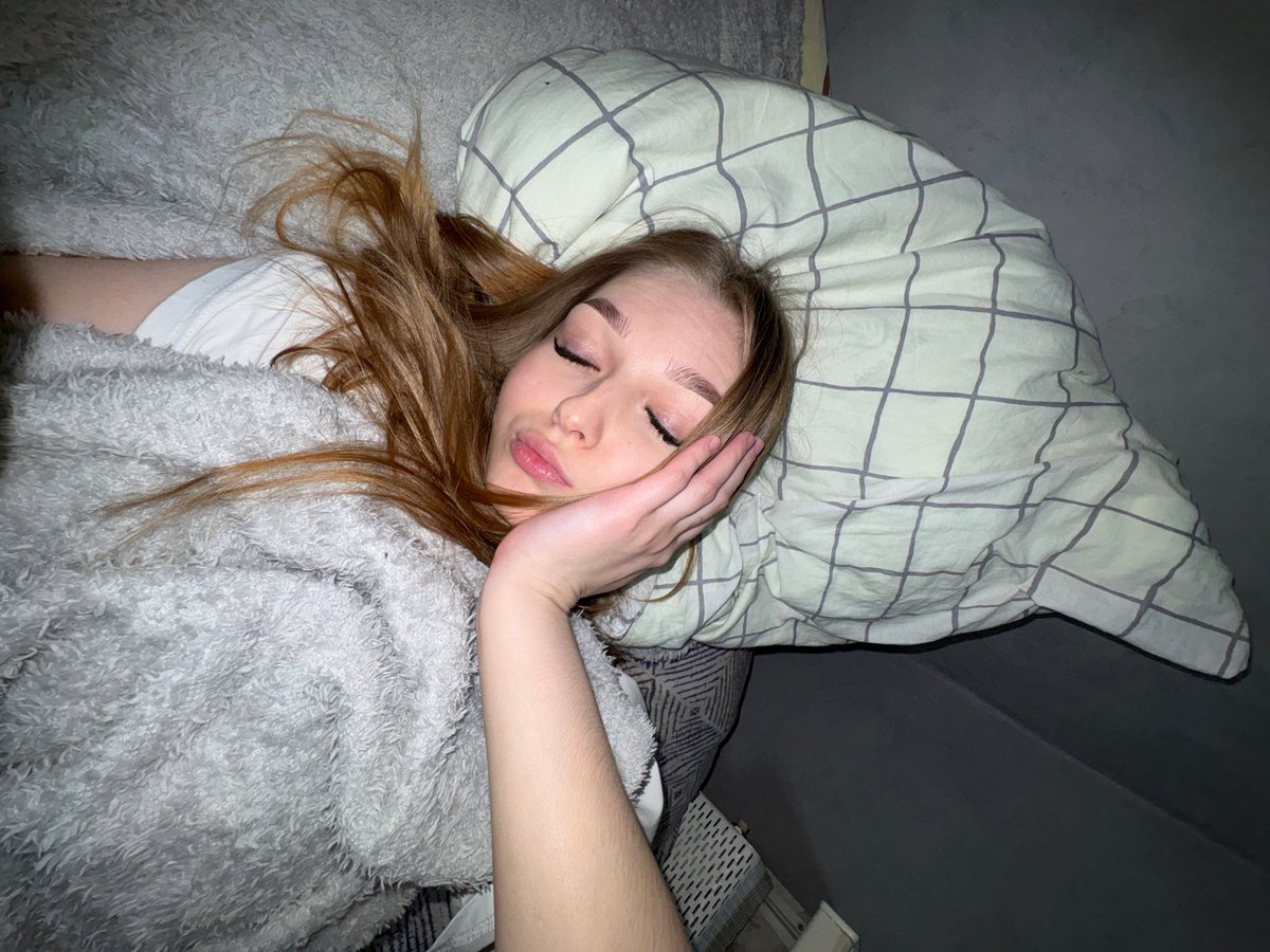Woman resting in bedroom captured in Chaikovsky, Russia