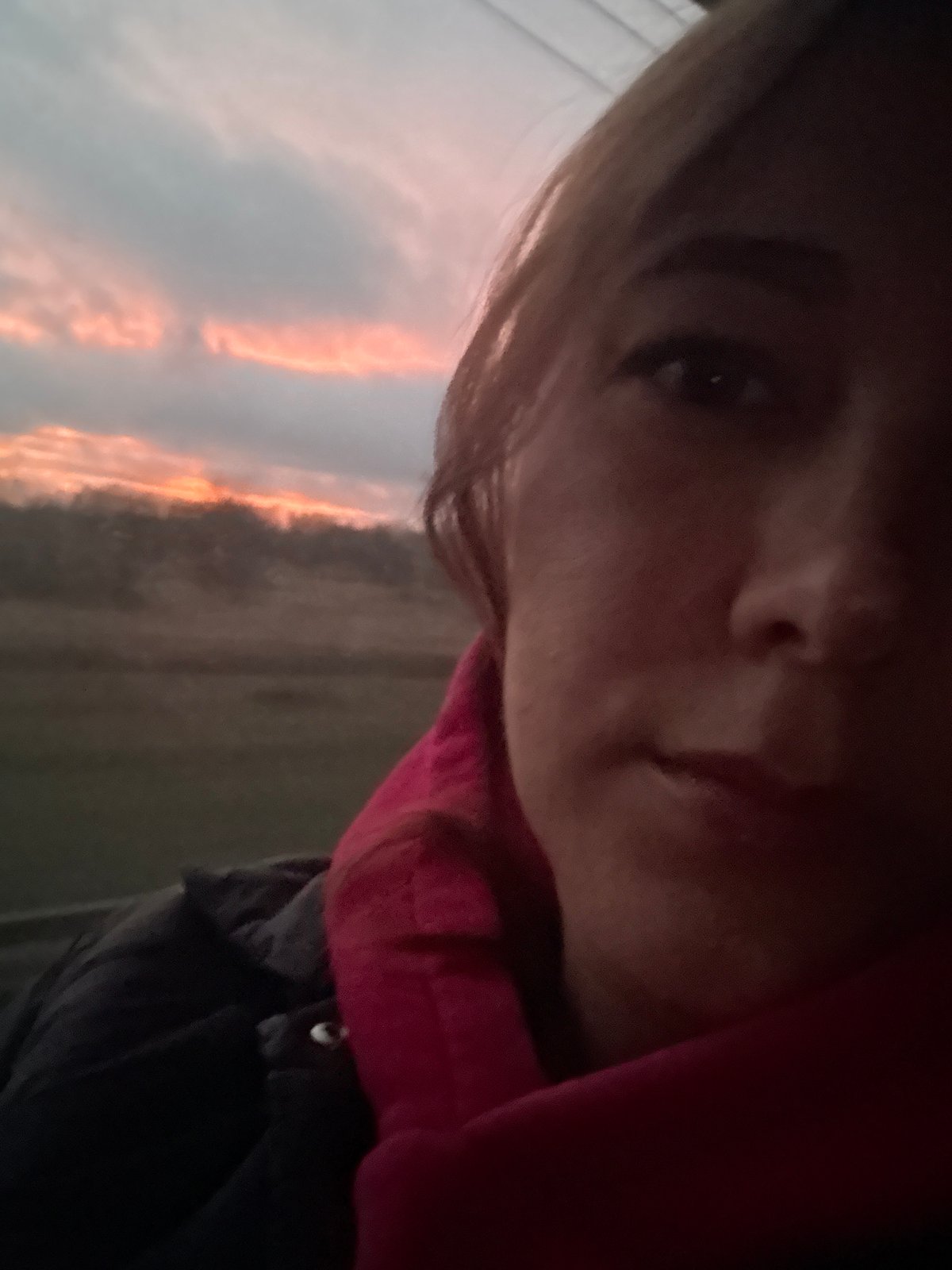 Person takes selfie at dawn in Russian village