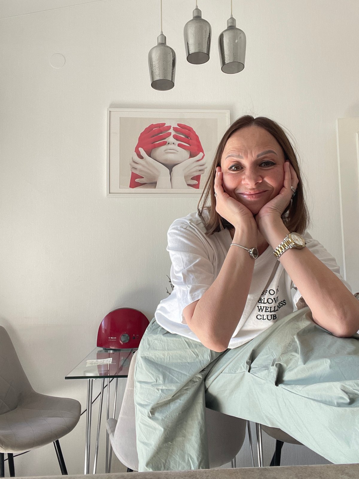 Woman documents tea service collection in Krasnoyarsk morning session