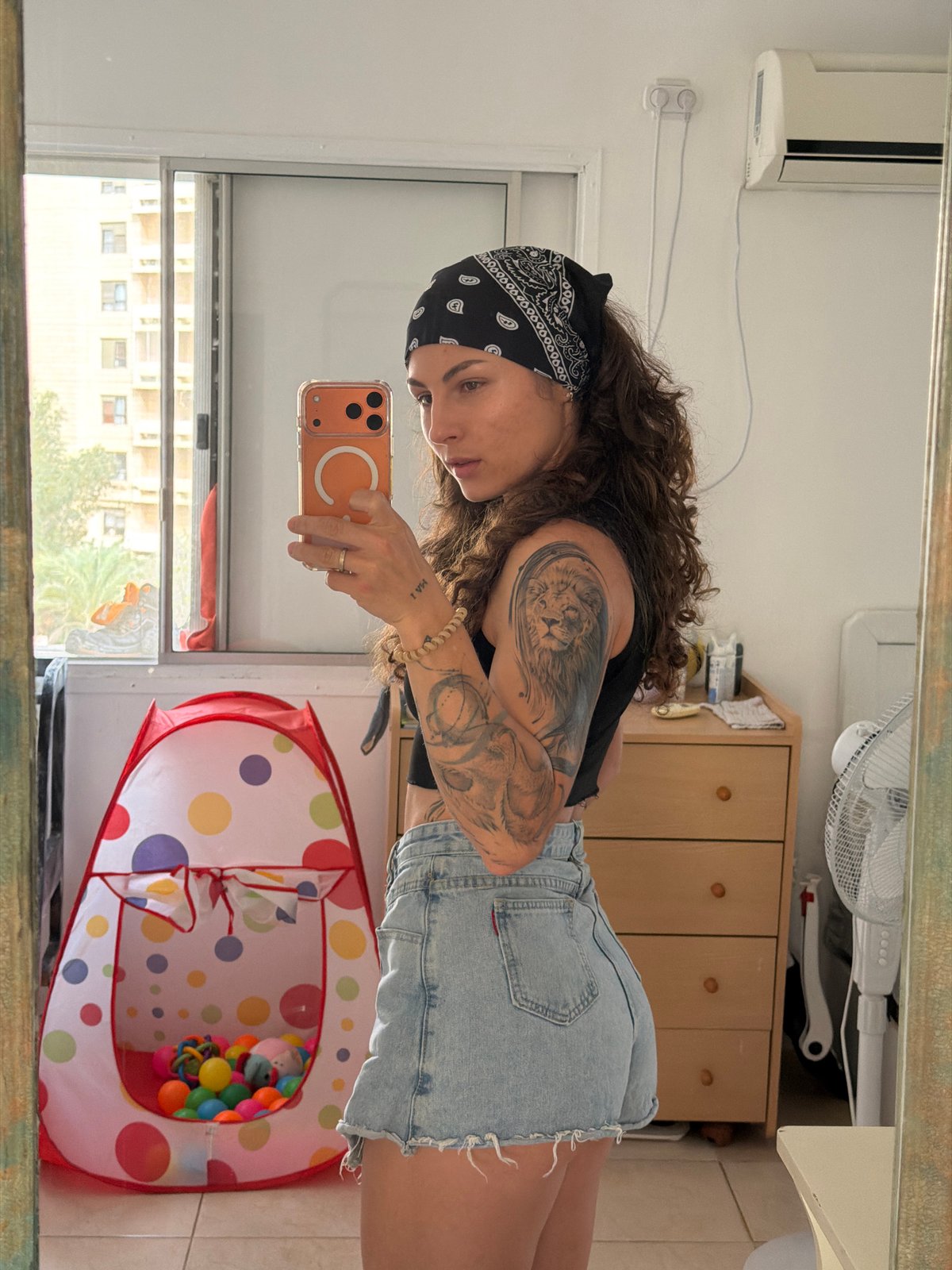 Woman takes mirror selfies in Kiryat Bialik residence