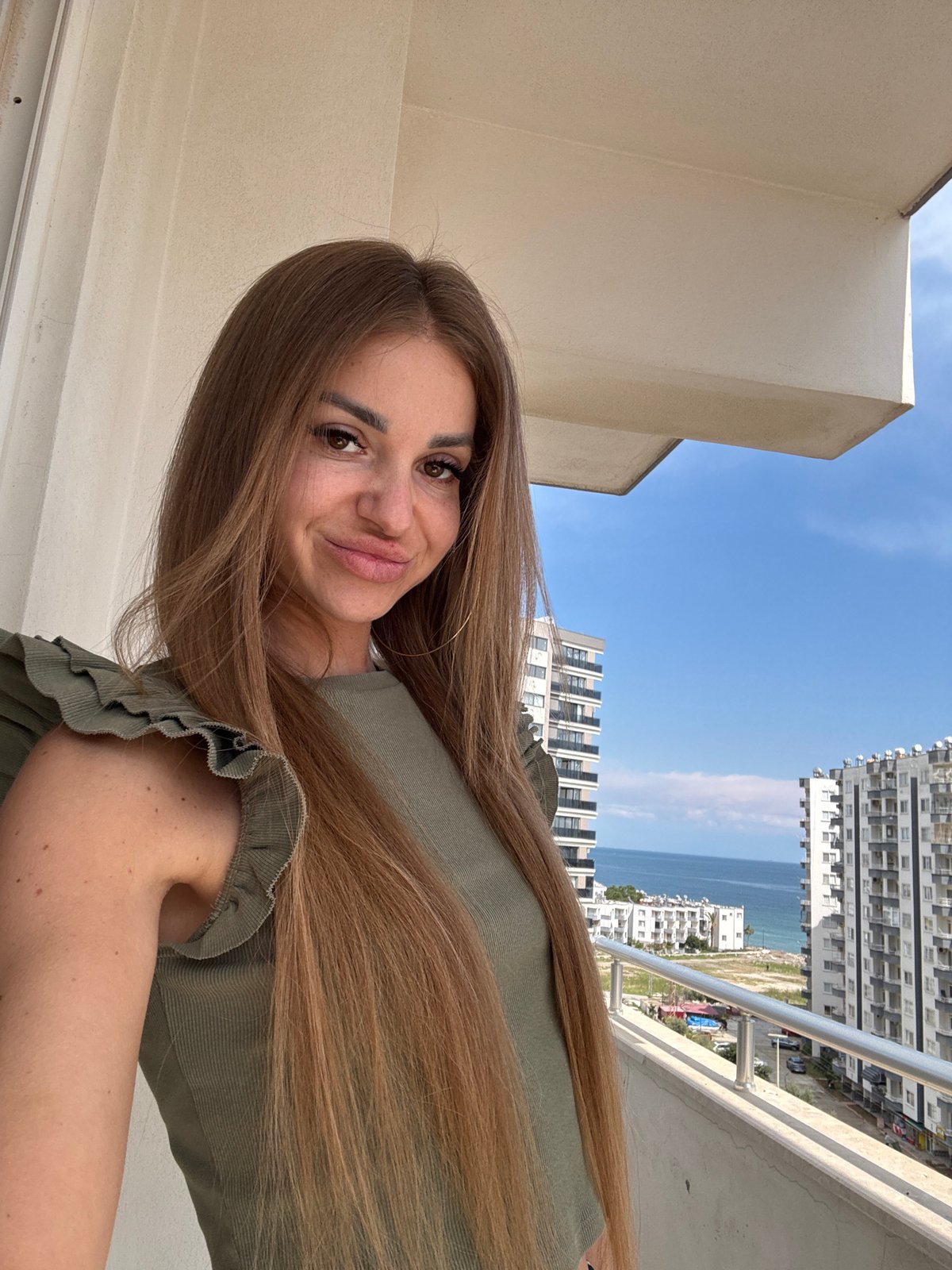 Woman documents fish cooking and dining experience in Erdemli