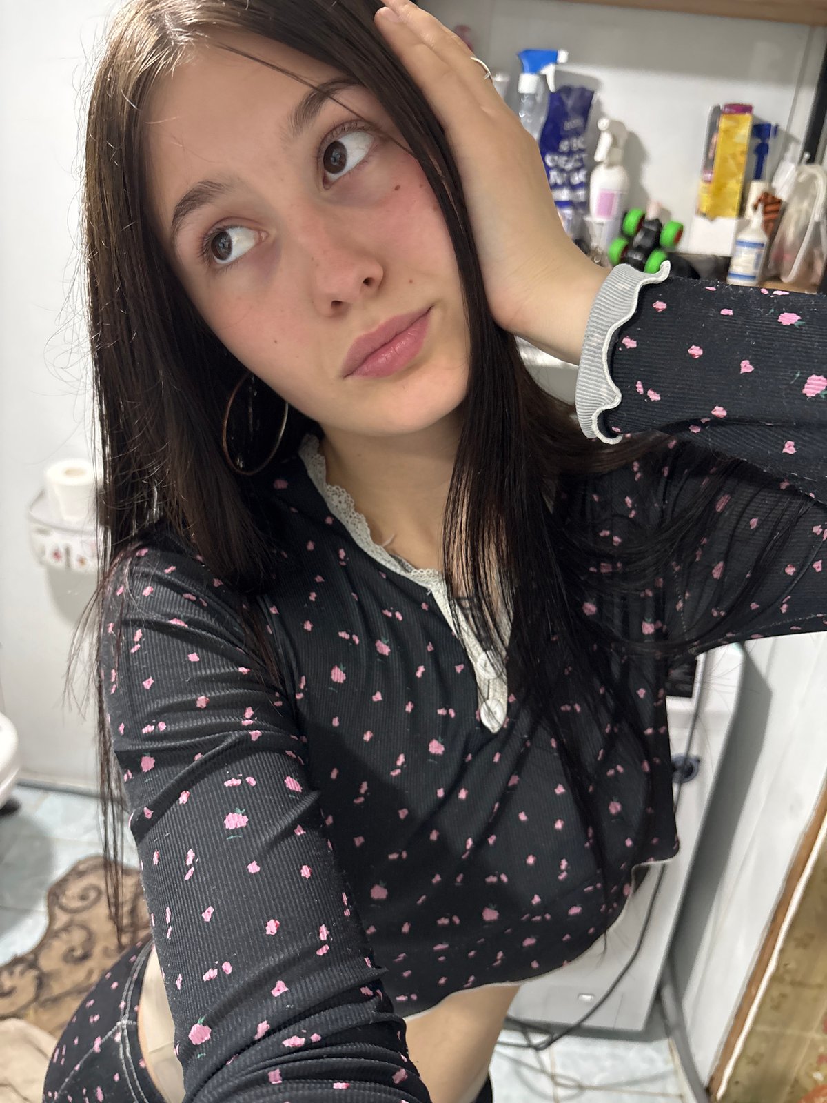 Young woman documents evening moments through selfies in Фоки, Russia