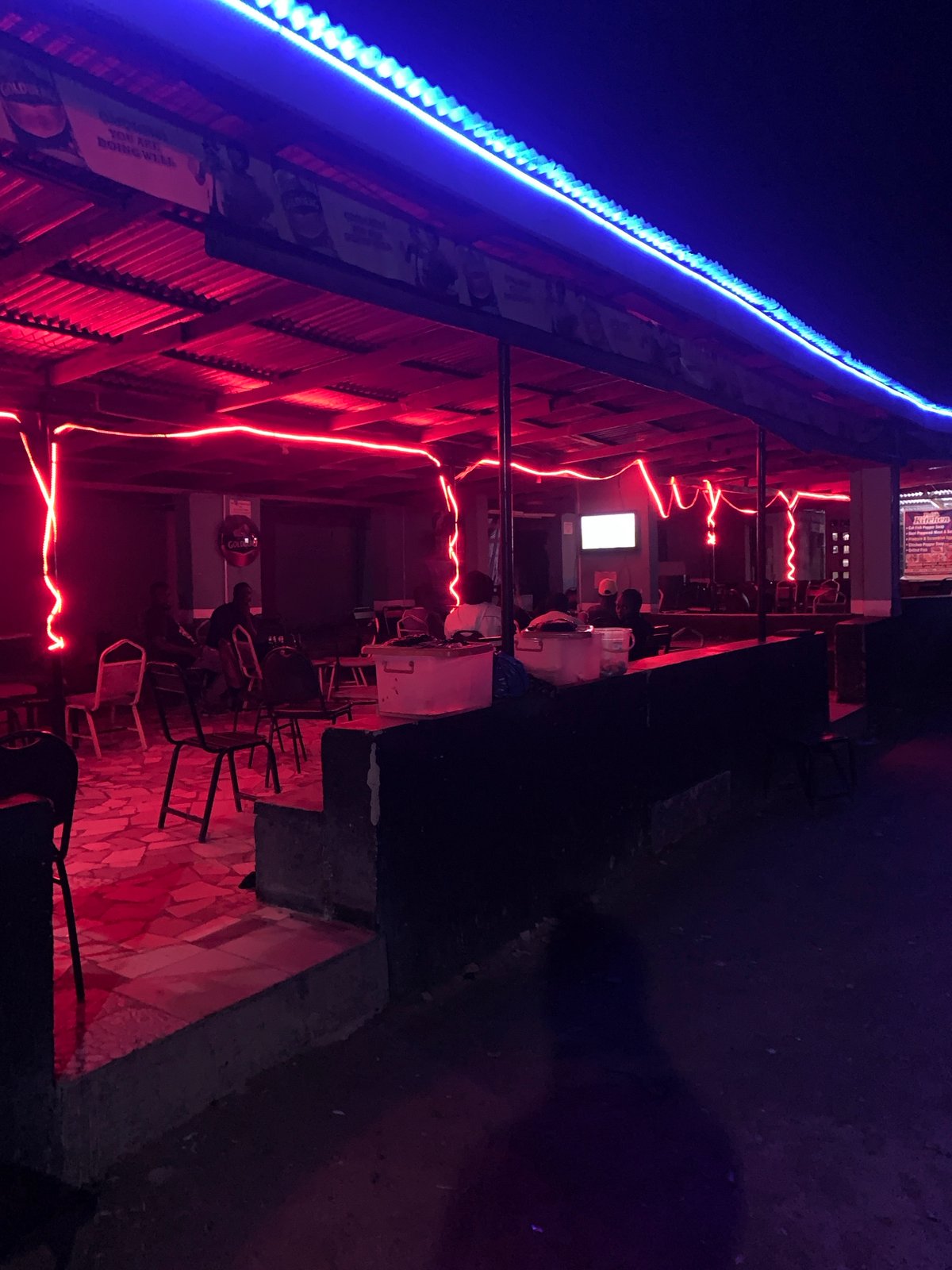Nightlife scenes documented around New Stadium, Nigeria bar district