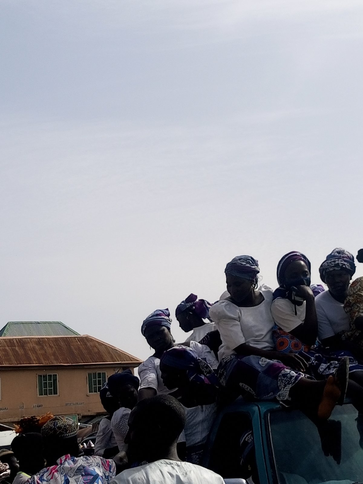 Busy marketplace activity around gas station in Gombe, Nigeria