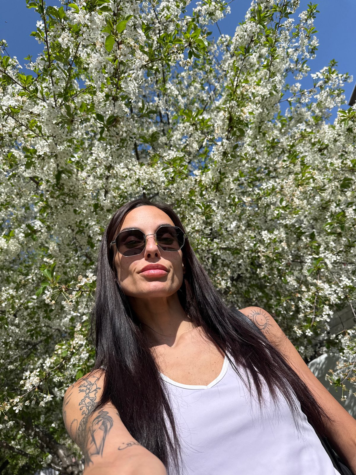 Woman photographed outdoors in bright sunlight in Pleven