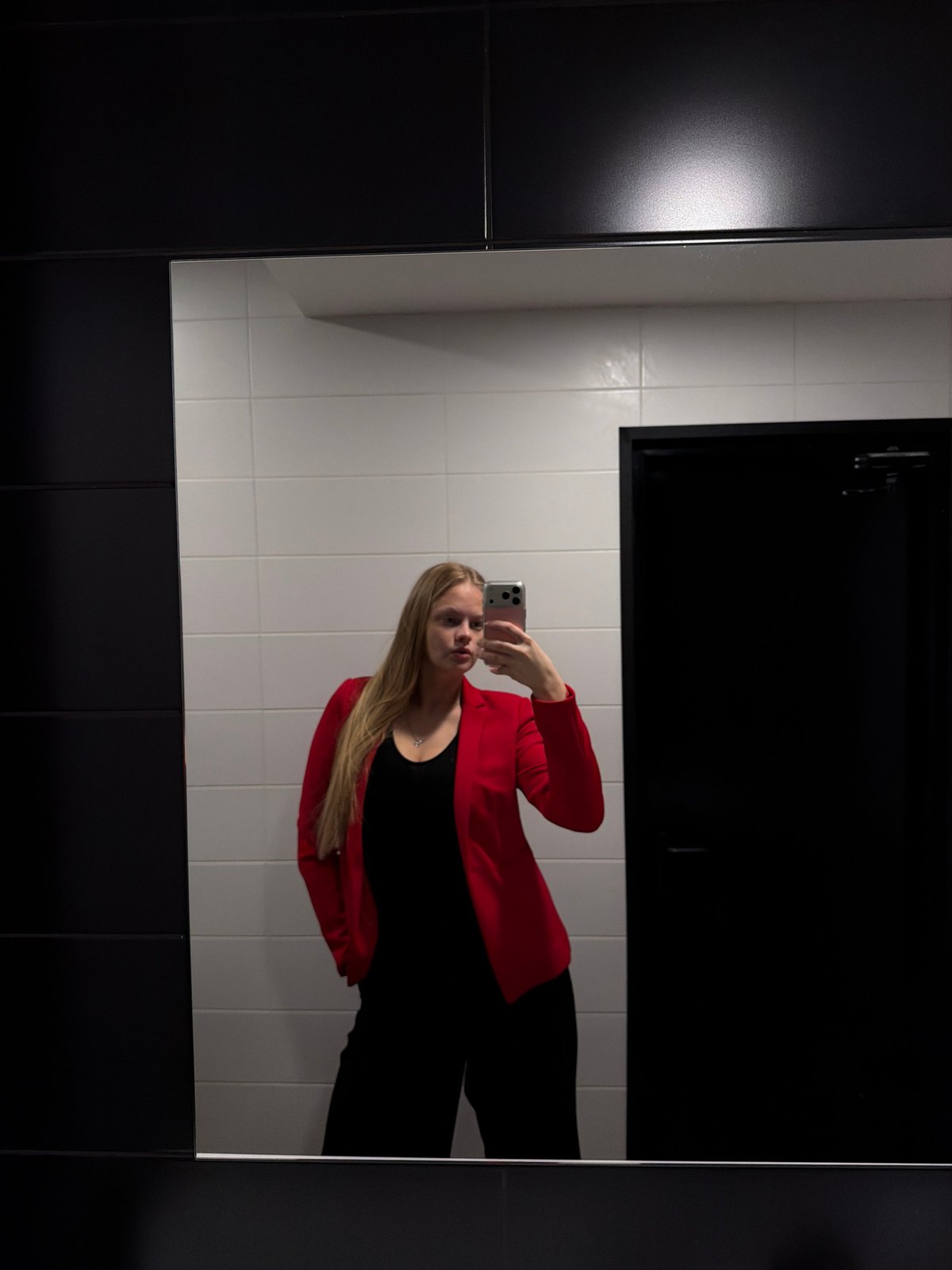 Woman takes mirror selfies in Izhevsk bathroom
