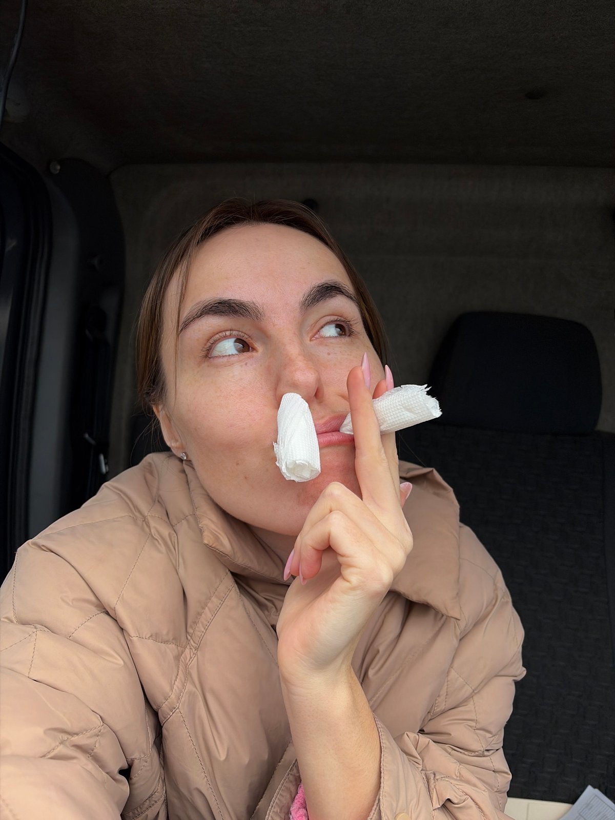Woman with tissues photographed in vehicle in Izhevsk