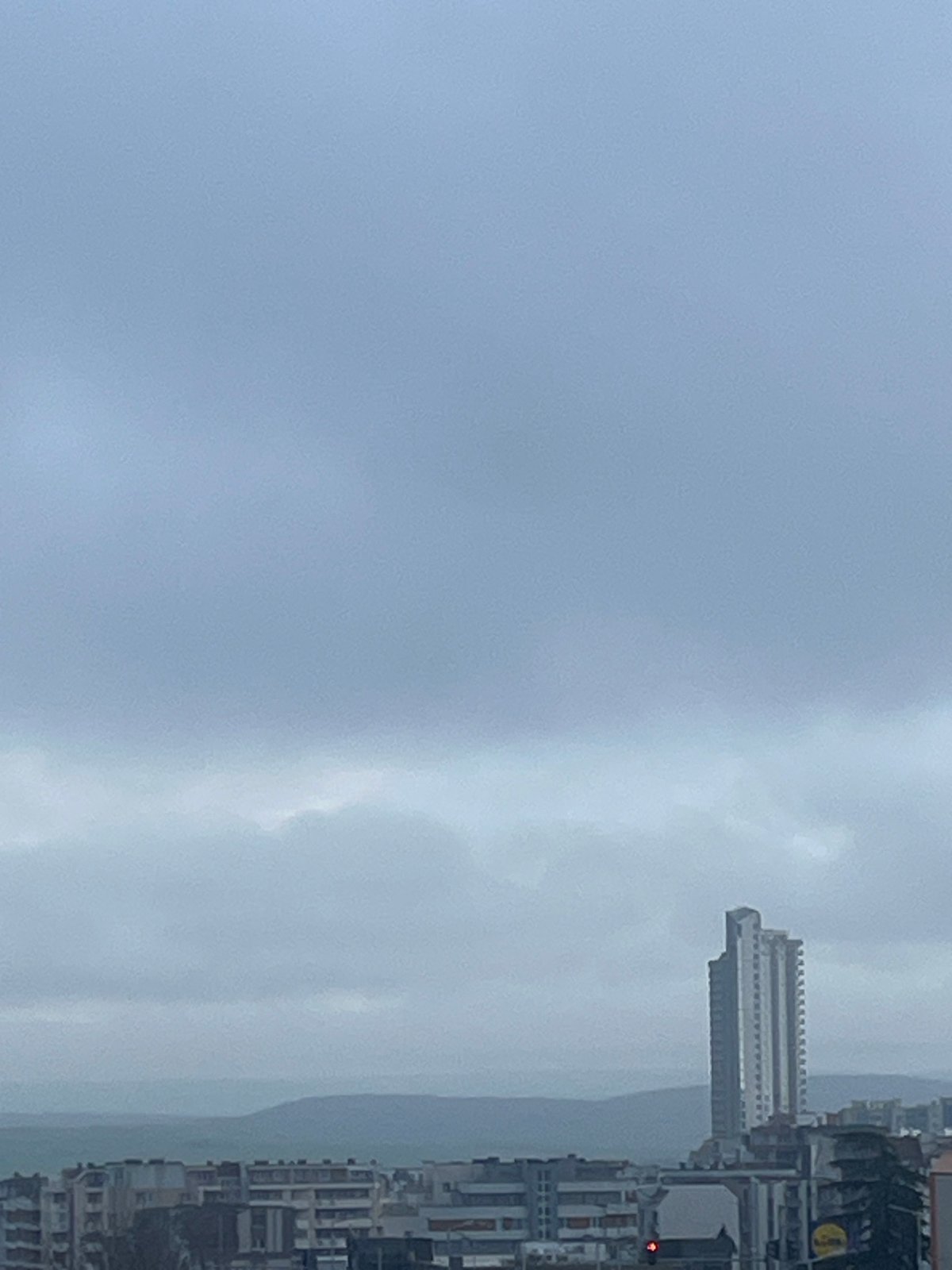 Overcast afternoon in Burgas captures cityscape and pancake cooking