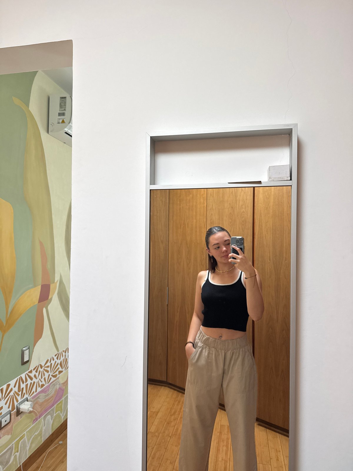 Woman takes mirror selfie in Tlaxcalancingo, Mexico