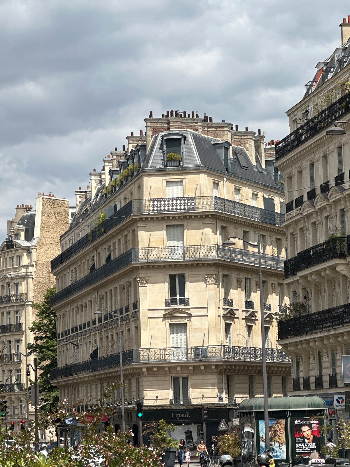 Haussmannian facades and wide avenues on a clear Paris afternoon