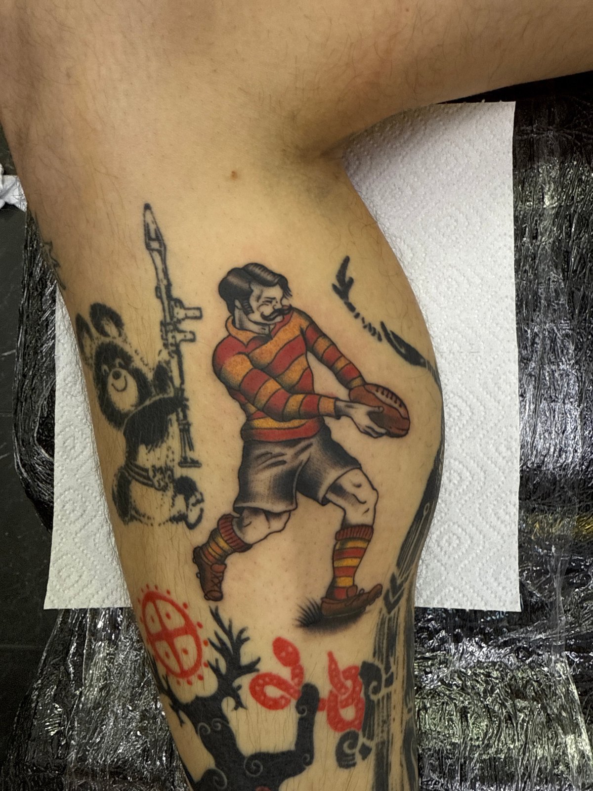 Tattooed person with rugby artwork spotted in Moscow studio