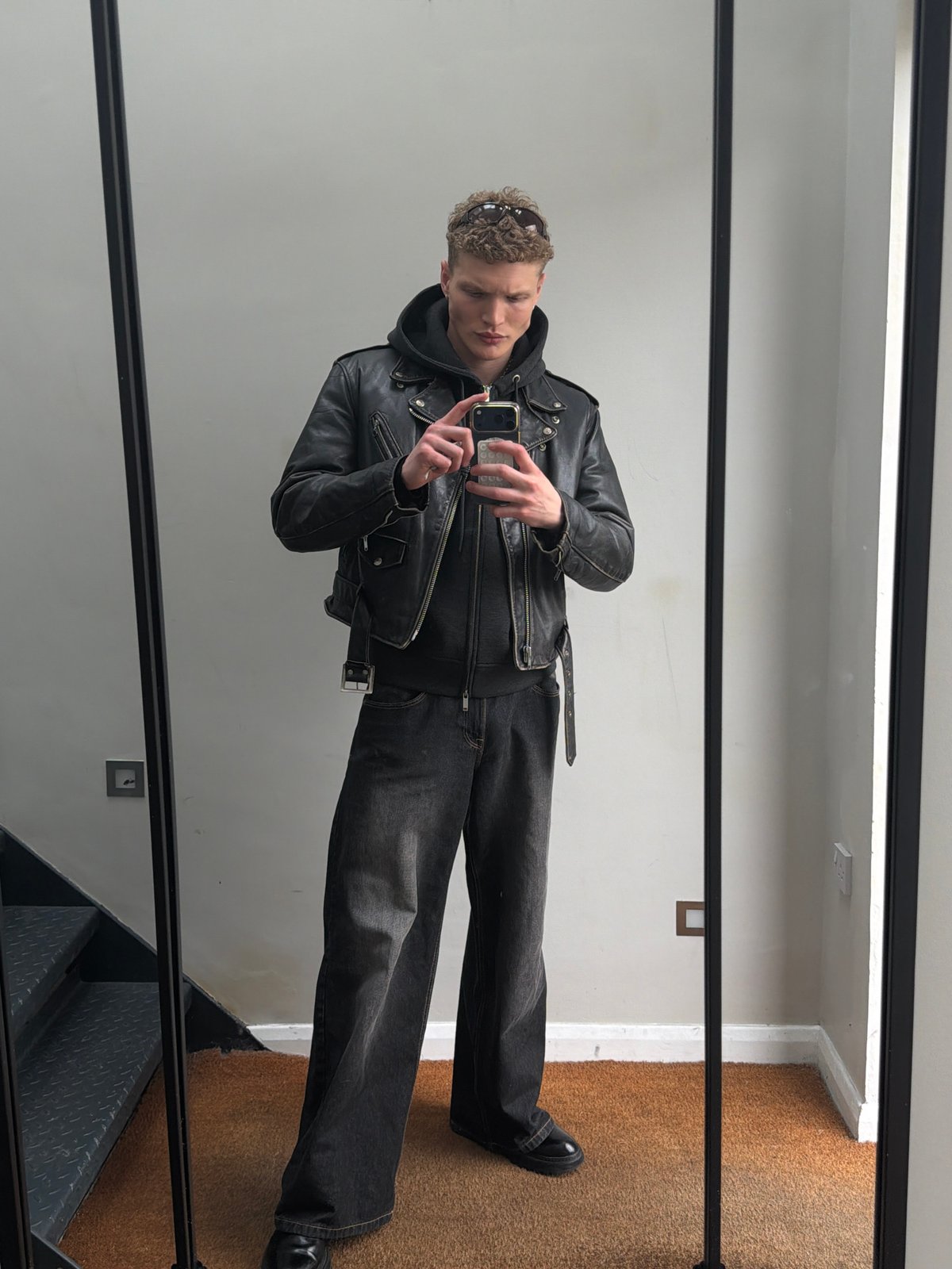 Man in leather jacket spotted in London mirror reflection
