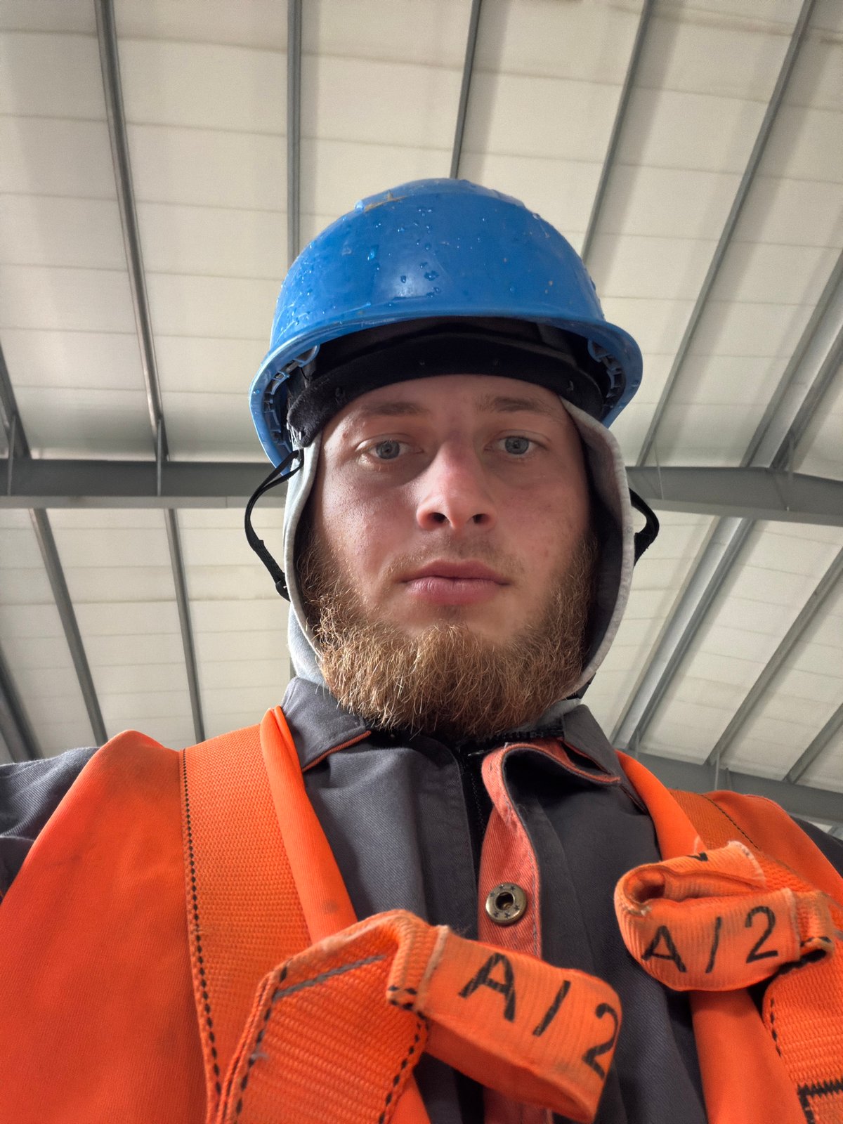 On-site in Janowice: hard hat and safety harness, July 2026
