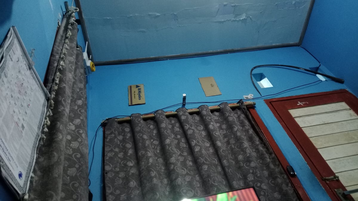 Hanging out in a blue-walled room in Denpasar, Bali