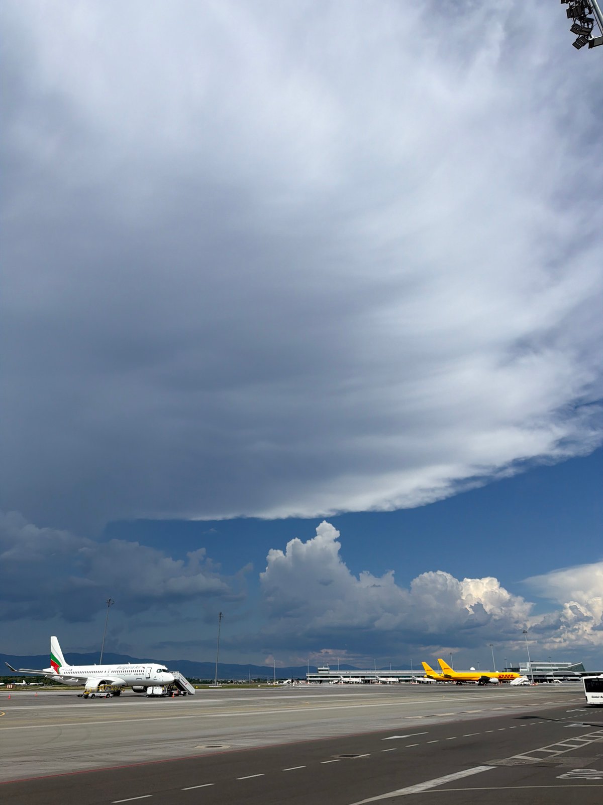 Aircraft parked at Sofia Airport amid stormy conditions