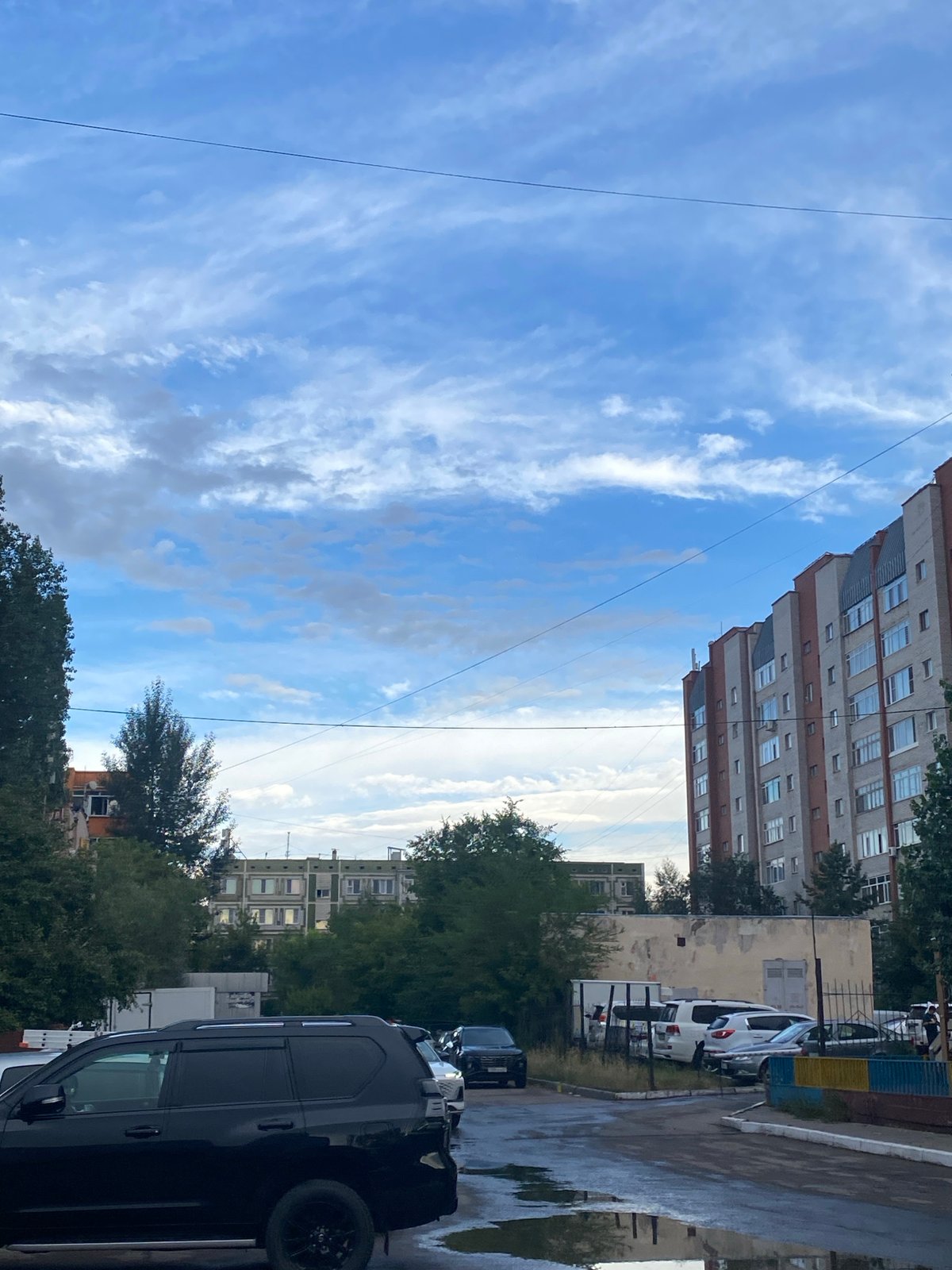 Apartment blocks, a construction site, and a midday moment