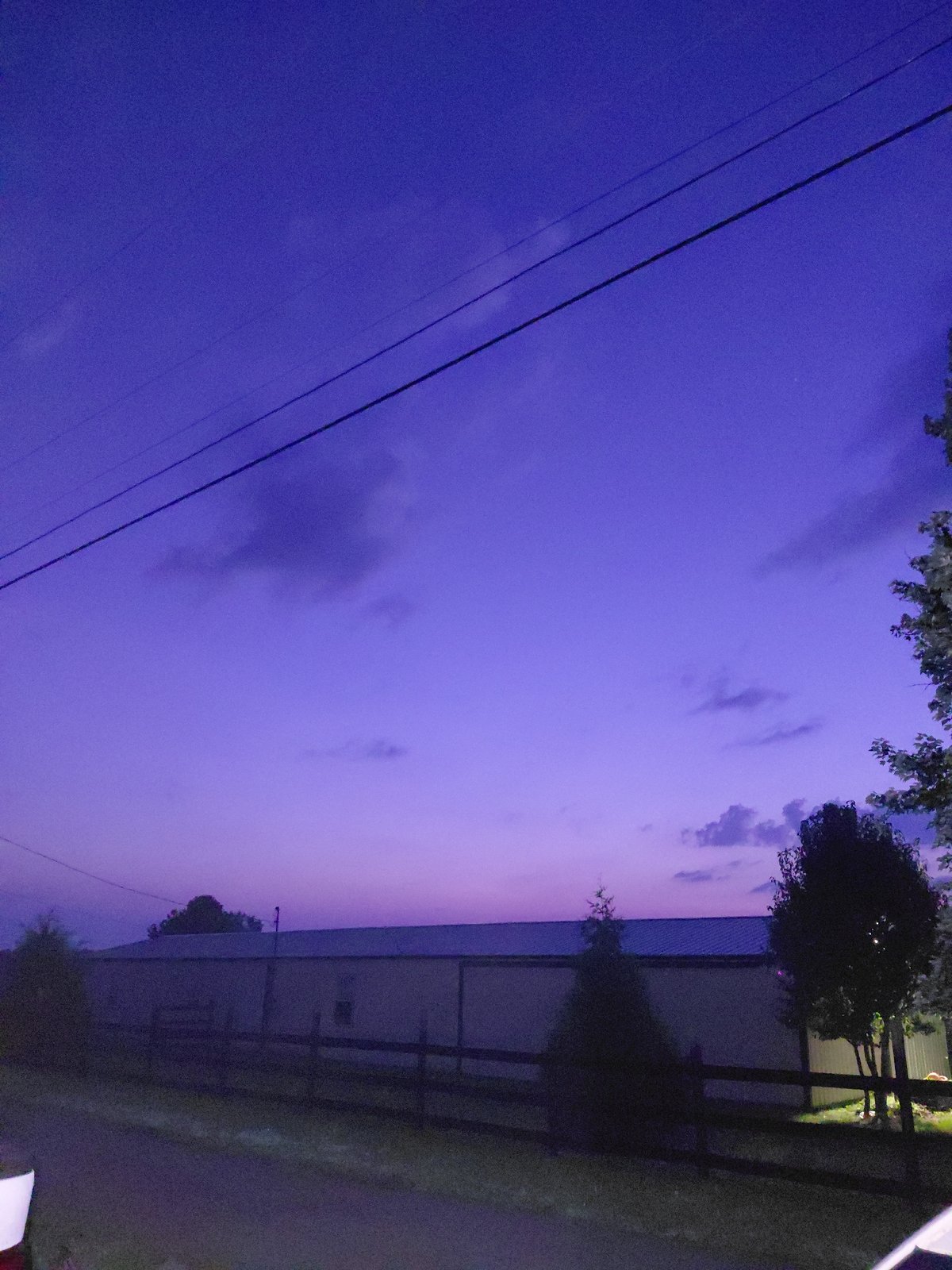 Twilight settles over a flat-roofed building in Richmond, Kentucky