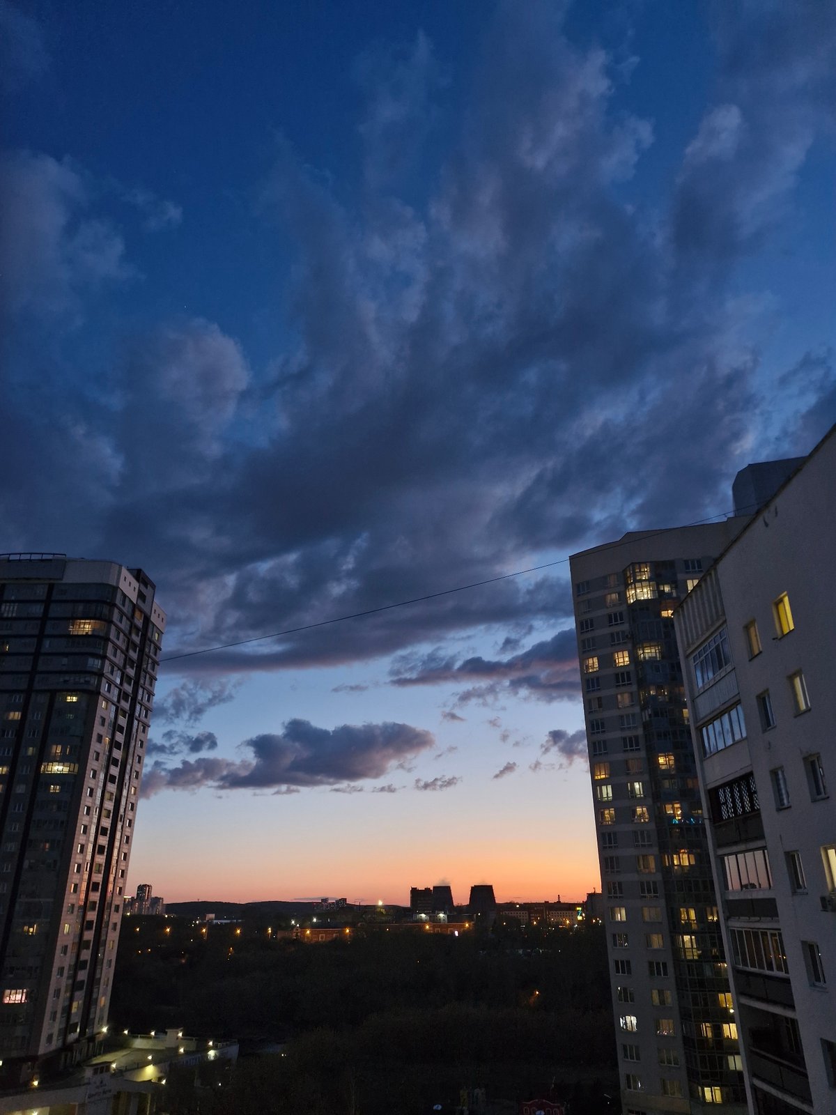Evening scenes documented in Yekaterinburg include cityscapes, white cat