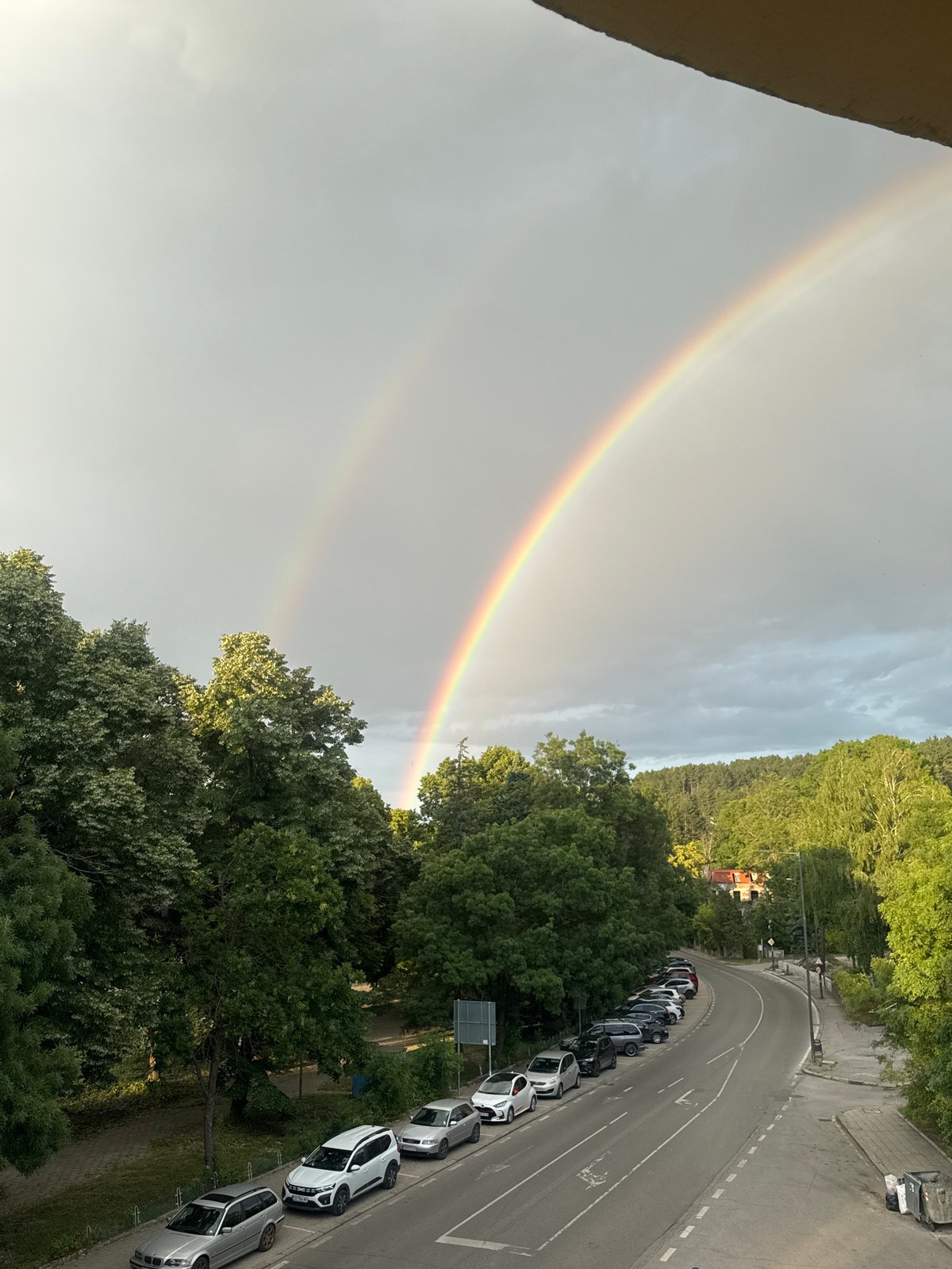 Double rainbow over Bankya's tree-lined streets after rain