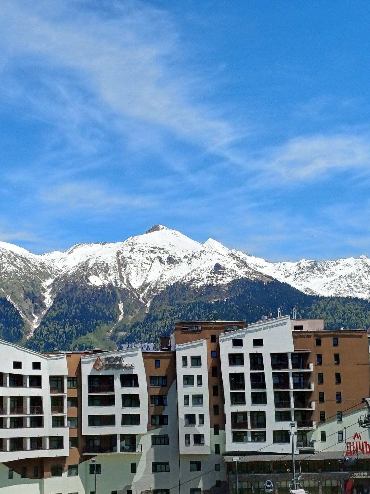 Resort development photographed against snow-capped mountains in Estosadok, Russia