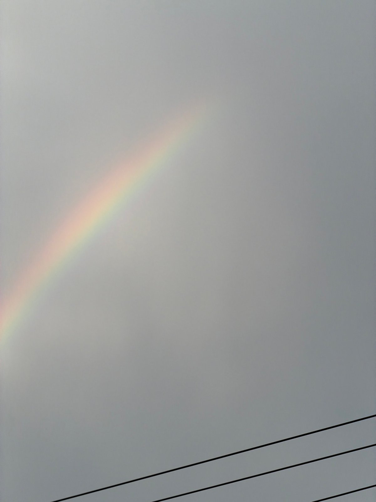 Faint rainbow spotted across multiple Vietnamese districts during overcast morning