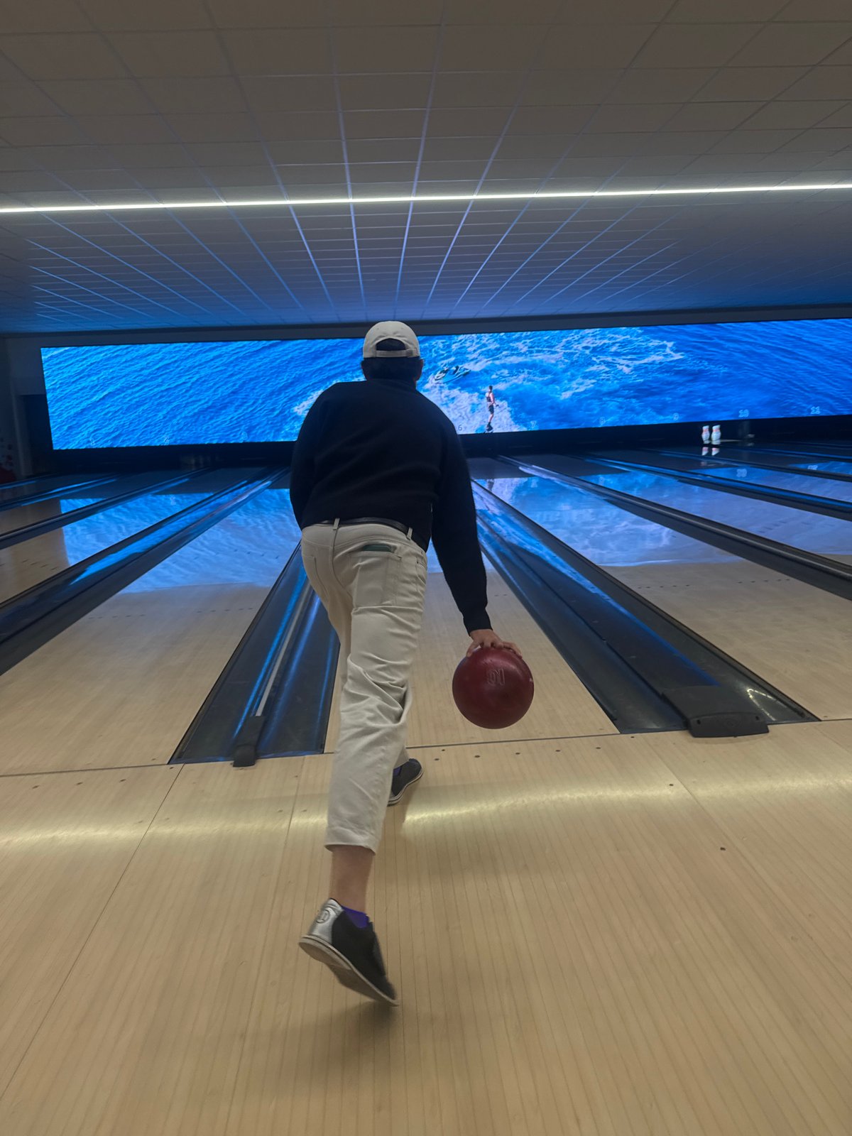 Person bowls at Milan alley Friday evening